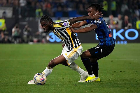 Samuel Iling-Junior, left, and Ademola Lookman challenge for the ball